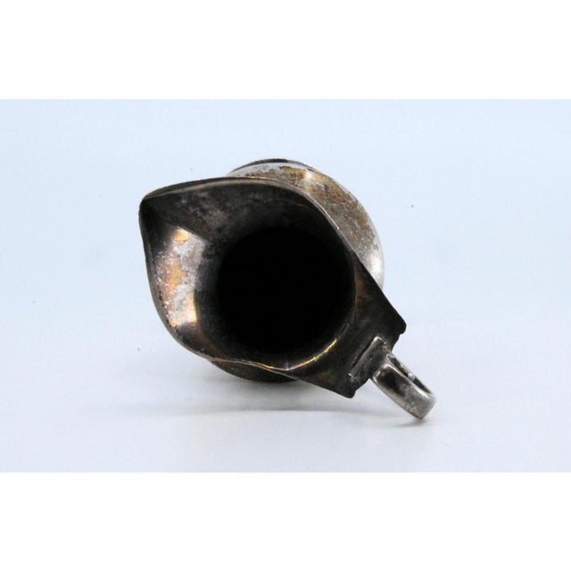 Wine Jug in Plain Silver, Set on a Beaded Base, in Very Good conditions. Designed from 2000 This piece has an attribution...