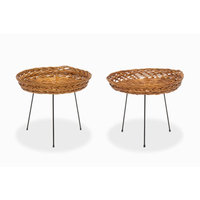 Here is a wonderful pair of rattan side tables with wrought iron tripod bases. Their origin is unknown, perhaps French or...