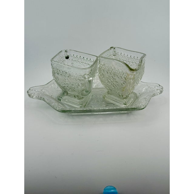 Vintage Indiana Glass Co. three piece set consisting of tray, creamer and sugar bowl in the Sandwich Tiara pattern. This...