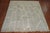 A piled Turkish rug with a motif resembling New Production rugs woven in Tibet. Colors in gray and ivory with a soft green...