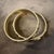 This rare duo of Chanel bangle bracelets captures the bold, high-contrast glamour of the 1990s. Crafted in heavy gold-...