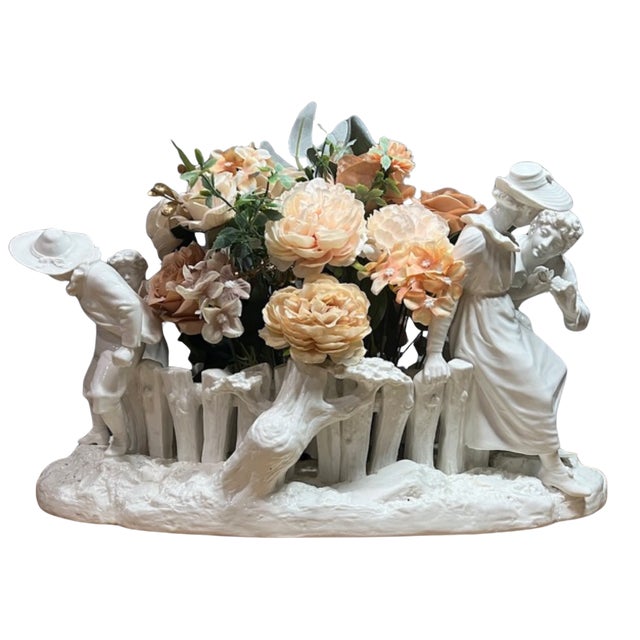 This nearly 20-inch-wide Royal Worcester centerpiece, modeled by James Hadley around 1890, is a masterful orchestration of...