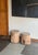 A beautifully aged antique teak side table originating from Java, Indonesia, distinguished by its sculptural simplicity...