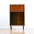 This fabulous mid century bar cabinet was made in England during the 1960s. Produced in Mahogany, the top cabinet doors...
