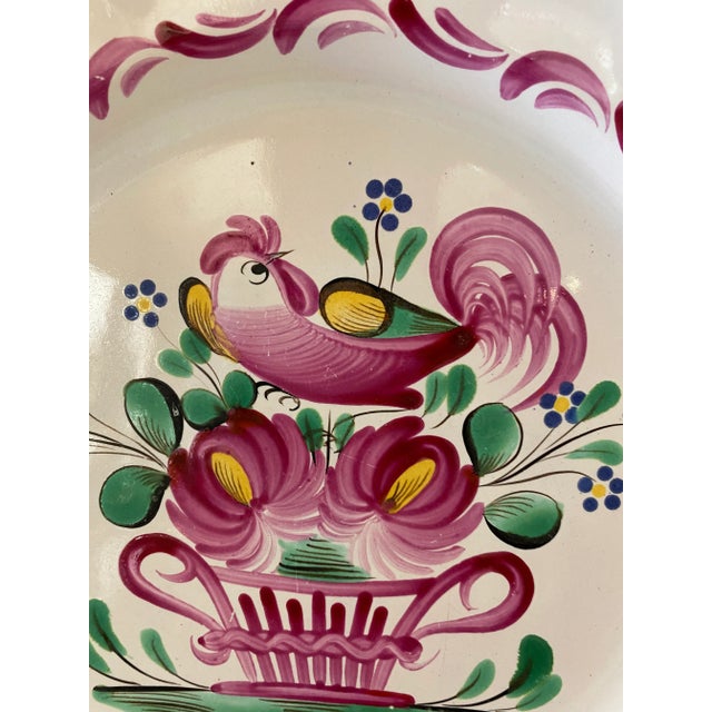 Antique decorative hand painted faience plate with iconic pointed rose drip glaze, rooster, flowers and basket made in St...