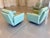 A pair of modern turquoise flight lounge chairs by Mario Bellini. Great pair of chairs that are very comfortable to sit...