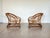 Pair of 1970s rattan and bamboo armchairs, frame on wheels, missing cushions