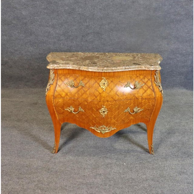 Elevate your interior design with this exquisite Signed Jansen French Bronze Mounted Marble Top Commode, a true testament...