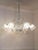 1930s blown glass chandelier by Murano Barovier & Toso. The central structure and the cups are made of bullicante glass, a...