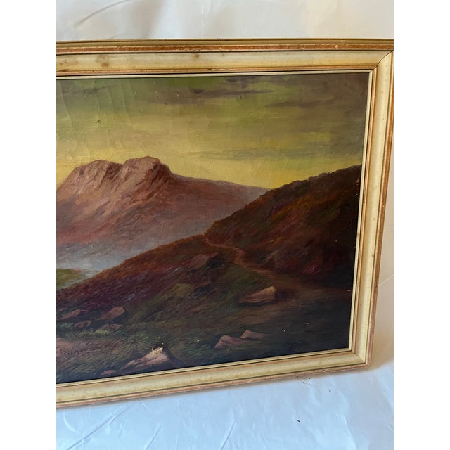 A beautiful vintage Hudson Valley studio oil on canvas painting of a mountain landscape with a river at dusk with pink...