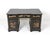 Stunning chinoiserie desk with lustrous black lacquer finish glows with intricate hand painted gilt accented and Asian-...