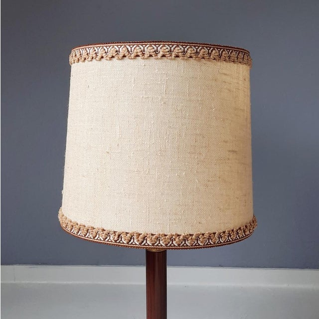 This classical table lamp is made of black marble, faux bois, metal and brass. Original 1960s shade. Originating from...
