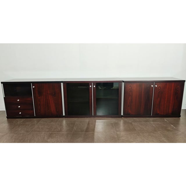 VITTORIO INTROINI (Attr.le) Made in Italy, ca. 1970 Five wood and aluminum modules, divided as follows: one module with an...