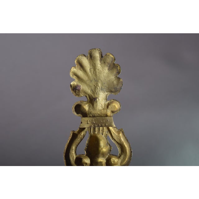 Set of three French 19th-century curtain holdbacks in gilt bronze. Each curved hook has matching foliate and fan-shaped...