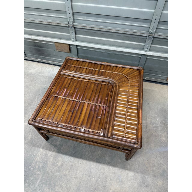 A lovely Palm Beach style square bamboo coffee table, featuring split bamboo and intricate woven detailing of the rising...