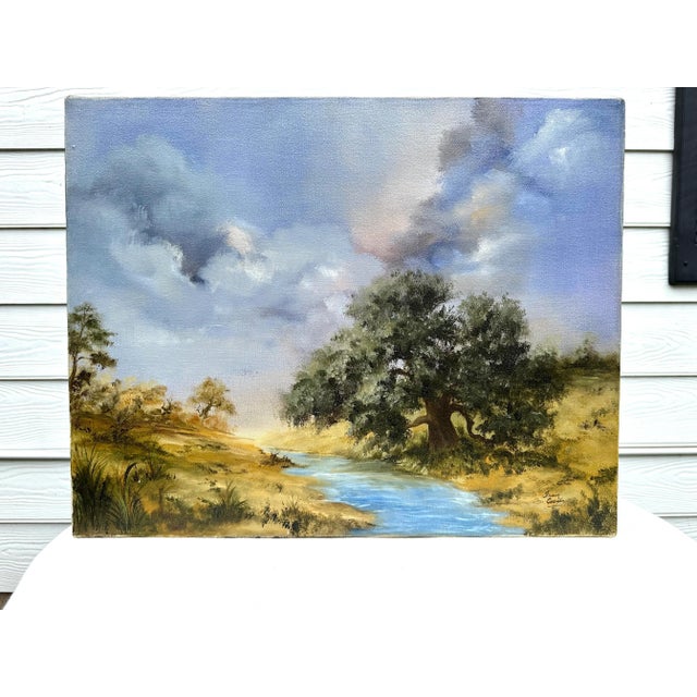 The "Nothing but Blue Sky" oil painting on canvas is exquisite in its composition in the shading of the sky amongst a...