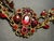 1950s Bohemian (Czech) Panel Link Bracelet Large Faceted Oval Ruby Glass Stone, Surrounded by Quatrefoil-Arranged Floral Clusters. For Sale In South Bend - Image 6 of 8