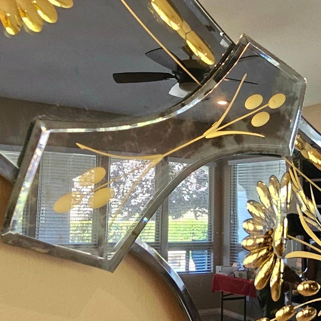 Amazing Large Italian Venetian Beveled mirror in excellent condition. The mirror has Gold accents all around and a light...