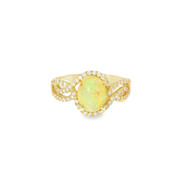 Gorgeous 14K Yellow Gold Ethiopian Opal Diamond Filigree Cocktail Ring. Metal: 14K Yellow Gold Center Stone: Natural Oval...