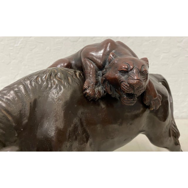 Fine Asian Bronze Sculpture "The Lion and the Bull" 20th c. Beautiful bronze of a lion attacking a bull. The bronze shows...