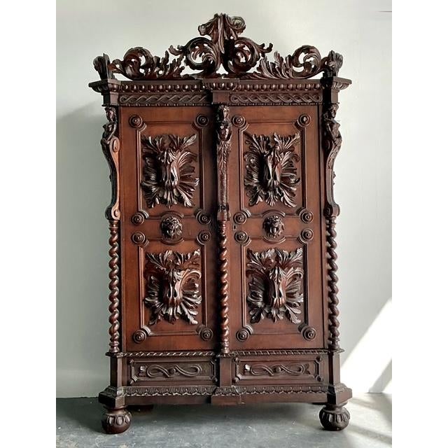 Make a monumental statement in your bedroom or living space with this breathtaking antique Black Forest style armoire....