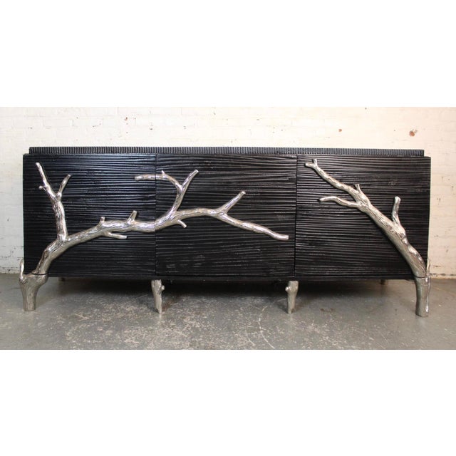 This seven foot long cabinet by Global Views features a beautifully crafted design with dramatic aluminum branches across...
