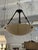 Design Plus Gallery presents a Hanging Pendant with a Faux Alabaster Bowl. This fixture has an inverted dish design...
