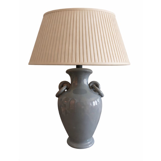 Discover an exceptional pair of antique Chinese porcelain table lamps, each featuring the distinctive pale sky-blue glaze...