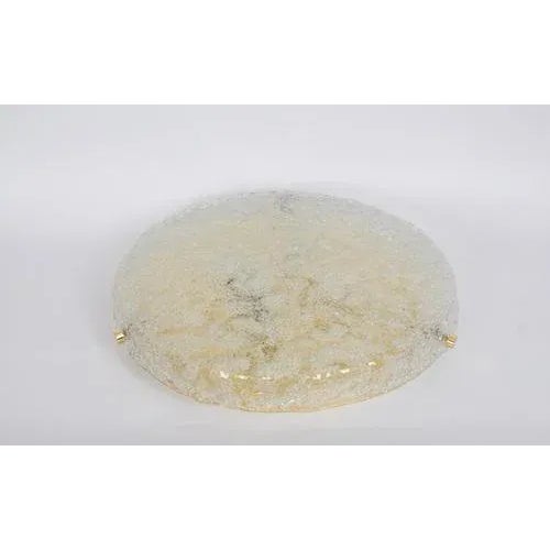 A wonderful round murano flush mount by hillebrand leuchten, germany, 1970s. Thick-blown glass fixtured on a brass base....