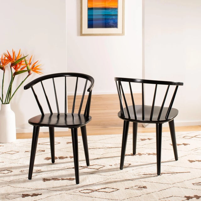 Inspired by the graceful curves of a antique captain’s chair, this set of two dining chairs is crafted of sustainable...