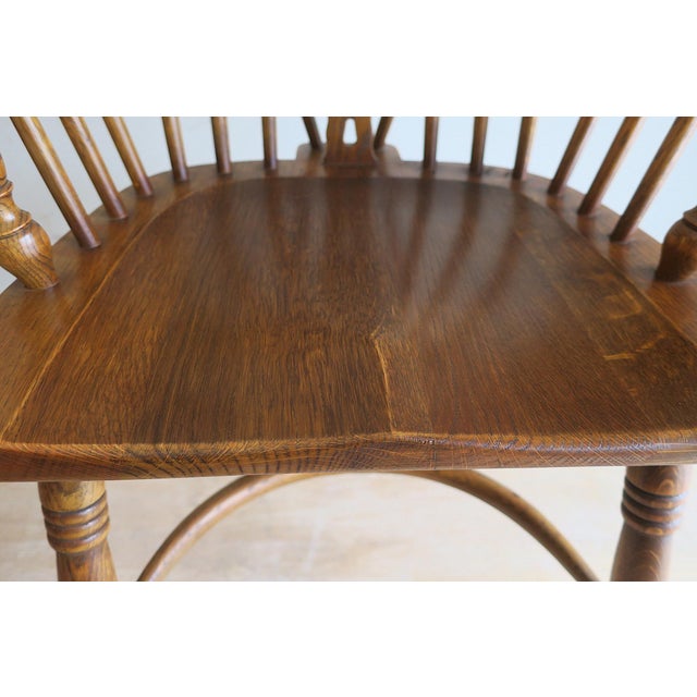 Solid oak lyre-back Windsor chair with a horse-shoe shaped arm bow, 1960s. Beautiful colour.