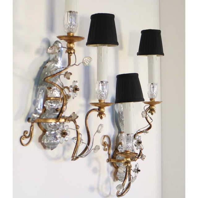 Stunning pair of sconces in the Maison Bagues style by Banci Firenze. Two lights per sconce. Decorative motifs in mirrored...