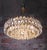 Elegant large and very impressive chandelier with faceted crystals on a brass frame. Manufactured by lobmeyr / bakalowits...