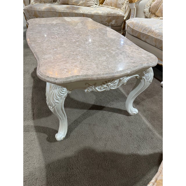 Graceful and refined, this Acme Furniture coffee table captures the romance of French Provincial design with elegant...