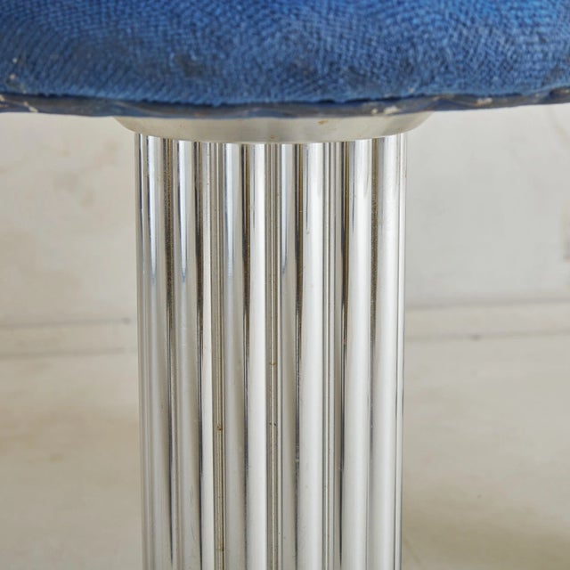 A pair of Design for Leisure stools with their easily recognizable fluted chromed nickel base. This pair has a curved back...