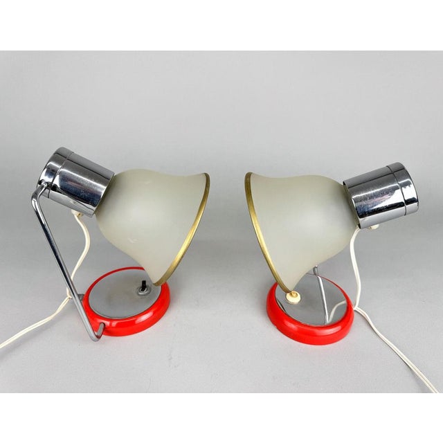 Set of two vintage table or bedside lamps. Made of chrome, metal and glass. Original, fully functional wiring. Bulbs: 2 x...