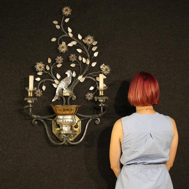 Large Italian wall light from the second half of the 20th century. Crafted from iron, brass, crystal, and glass, this...