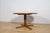 The round teak table was produced by the British McIntosh factory in the 1960s. The piece of furniture has a elegant,...