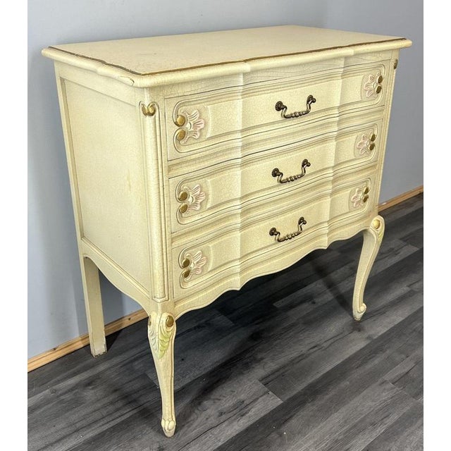 This elegant Vintage Louis Shabby Chic chest of drawers features a beautifully aged crackle-cream finish with soft pink...