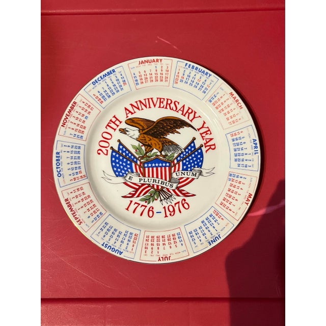 Vintage 1976 Spencer Gifts Bicentennial calendar plate featuring an American eagle design. This plate was produced in...