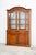 It is composed of two pieces of carved beech wood furniture, walnut colour. Brass handles. The doors are made of glass...