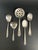A mixed lot of five silverplate serving pieces by the flagship brands of International Silver and Oneida, including a...