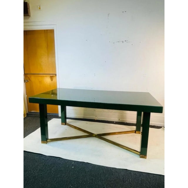 Modernist Dining Table In Deep Green Lacquered Wood And A Brass X Stretcher At The Base. Designed In The 1980's By Paolo...