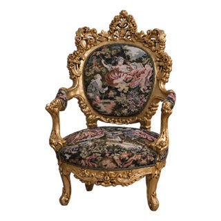 Opulent French Rococo Style Armchair – Gilded Carved Frame With Scenic Floral Tapestry Upholstery For Sale