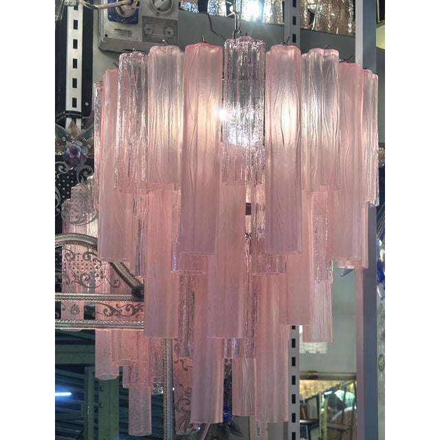 Contemporary pink and sanded pink “TRONCHI” Murano glass Chandelier . “Tronchi”are blown inside a wooden mold, into which...
