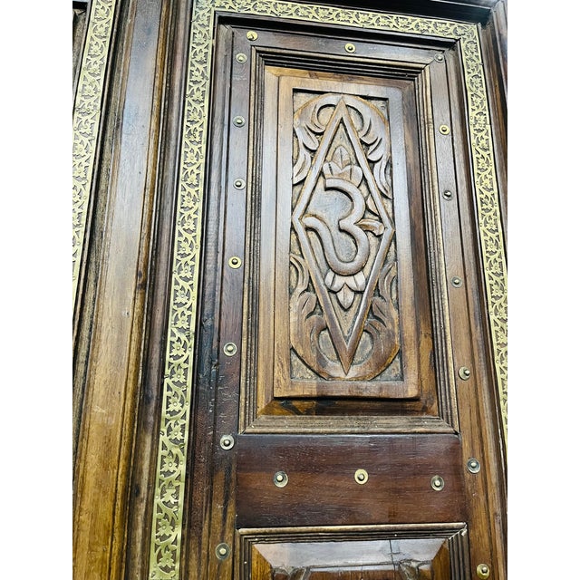 Infuse your space with spiritual artistry and timeless craftsmanship with these antique Indian temple double doors,...