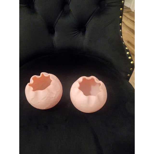 This is a pink satin glass rose bowl vase, potentially a vintage Victorian style piece, used as a decorative home accent