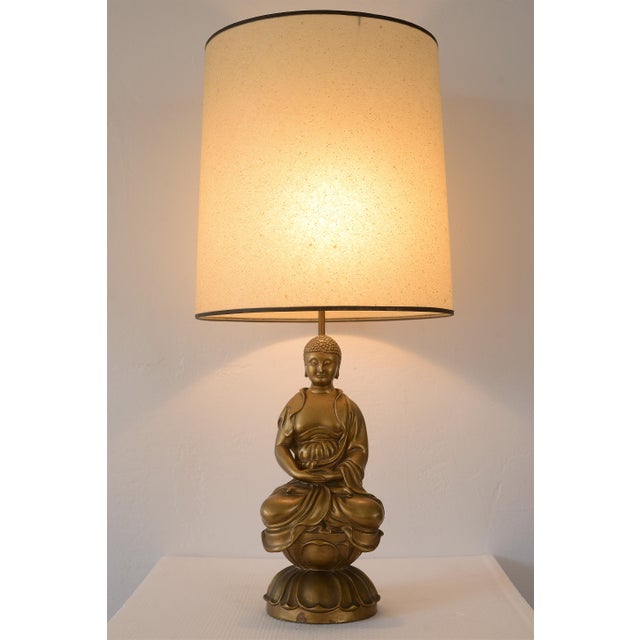 Very rare and gorgeous vintage mid century era ceramic buddha table lamp in satin gold finish from the Chapman MFG...