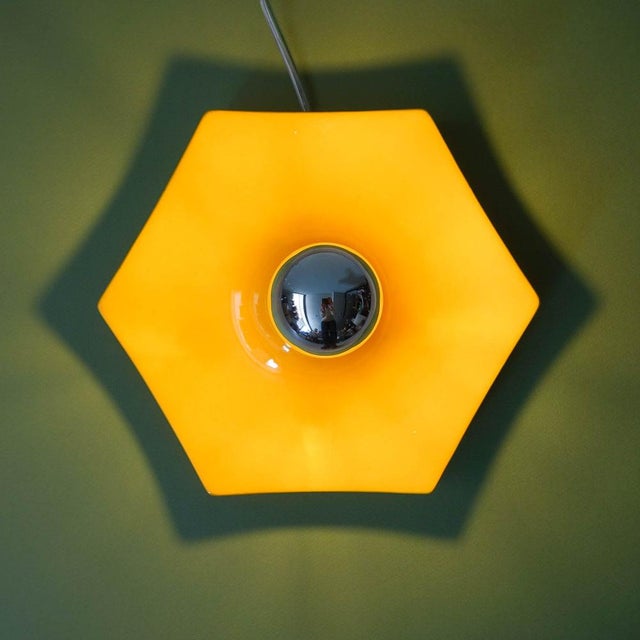 This wall lamp was designed and produced in Germany, during the 1970's. It is entirely formed by ceramic following a...