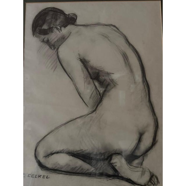 A striking signed female nude life study by carl felkel, executed in charcoal or black chalk on paper. The kneeling figure...